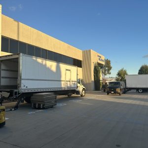 Shipping trucks at Cube World USA distribution center.