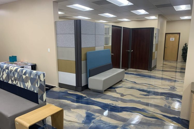Modern office interior with cubicles and seating areas at Cube World USA.