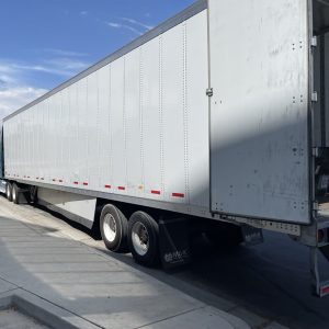 Large white shipping truck for nationwide and international deliveries.