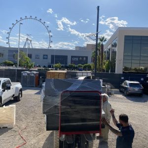 Loading large equipment for nationwide and international shipping at Cube World USA.