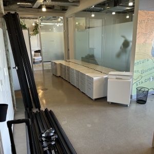 Office furniture and equipment during facility decommissioning and relocation at Cube World USA.