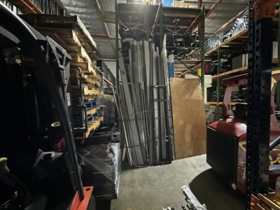 Warehouse with office furniture and equipment storage for rent.