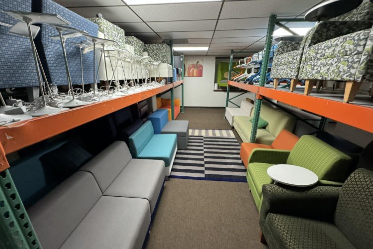 Showroom with furniture and flooring options at Cube World USA.