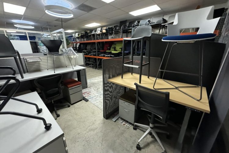 Office furniture showroom with chairs and desks on display at Cube World USA.