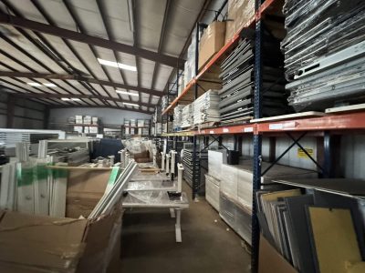 Warehouse with office furniture and supplies for rent or sale.