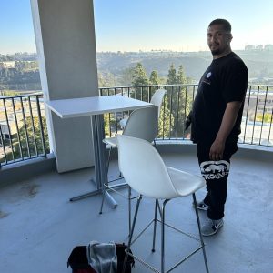 Installation of outdoor balcony furniture by Cube World USA.