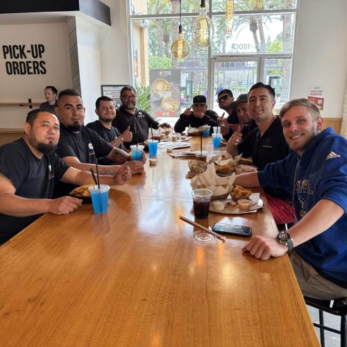 Group of commercial brokers and partners gathered at Cube World USA for a business meeting.