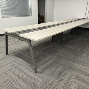 Modern office conference table in a corporate workspace setting.