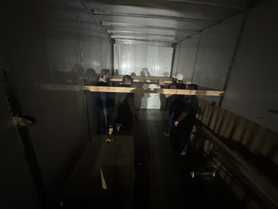 Liquidation of office furniture inside a moving truck at Cube World USA.