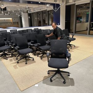 Office conference room with ergonomic chairs and large windows for meetings.