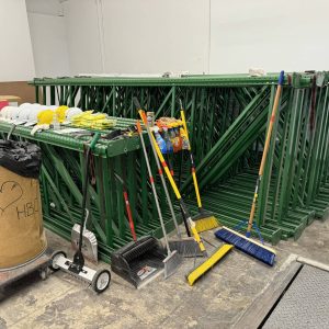 Scaffolding and cleaning tools for installation services at Cube World USA.