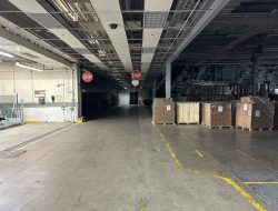 Warehouse interior during facility relocation at Cube World USA.