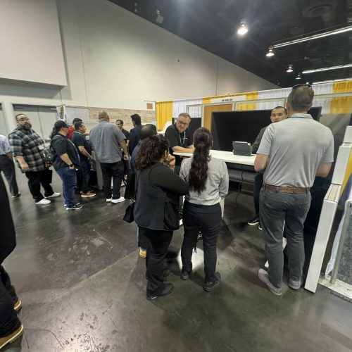 Attendees exploring Cube World USA booth at a commercial brokers conference.