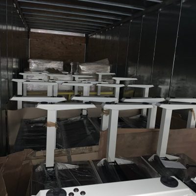 Shipping containers inside a truck for nationwide and international delivery.