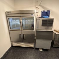 Commercial refrigeration and ice machine in a professional kitchen.